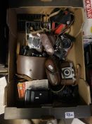 A collection of vintage cameras to include Kodak and Practika examples, cased pair of binoculas