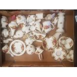 A mixed collection of Royal Albert old country roses to include candlesticks, vases, ornaments,