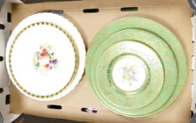 A collection of highly decorated wall plates to include graduated Minton floral and gild plates,