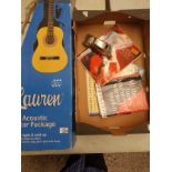 Boxed 'Lauren' branded 4/4 size guitar together with a small collection of music books and a