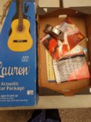 Boxed 'Lauren' branded 4/4 size guitar together with a small collection of music books and a