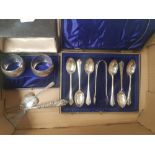 A collection of cased hallmark Silver tea spoons and sugar tongues, pair of cased hallmarked