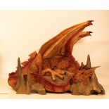 Large resin figure of a dragon on a rock