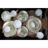 Aynsley green and gilded tea ware to include 2 cake plates, 8 trio's, milk jug, sugar bowl and