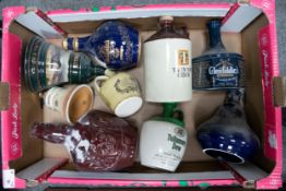 A collection of Wade Spirit / Whiskey decanters to include Glenfiddich, Bells, Tullamore dew etc