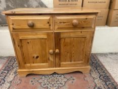 Stripped pine two door 2 drawer side cabinet on shaped plinth based 95cm W x 92cm H 46cm D