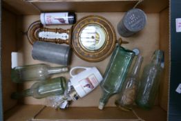 A mixed collection of items to include vintage bottles, antique coffee tins, wall barometer,