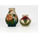 Two Moorcroft floral decorated vases dated 1999 and 1996. Height of tallest 13cm