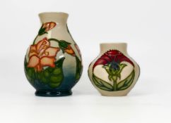 Two Moorcroft floral decorated vases dated 1999 and 1996. Height of tallest 13cm