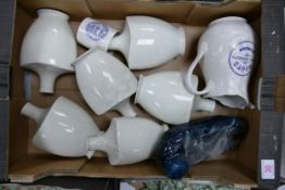 A collection of Wade Boots Chemist Adverting Jugs, Vases, Bed Warmer etc . These items were