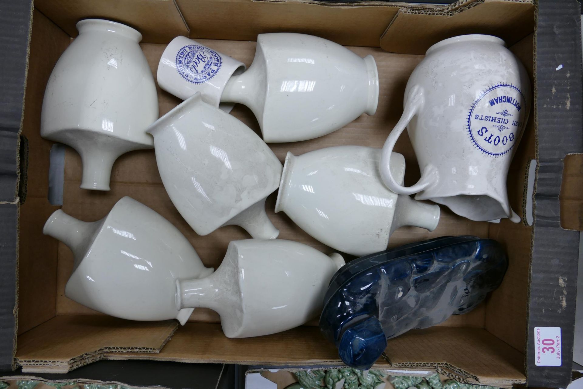 A collection of Wade Boots Chemist Adverting Jugs, Vases, Bed Warmer etc . These items were