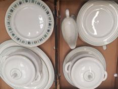 A collection of dinner ware items in the Royal Doulton Berkshire pattern and tapestry pattern