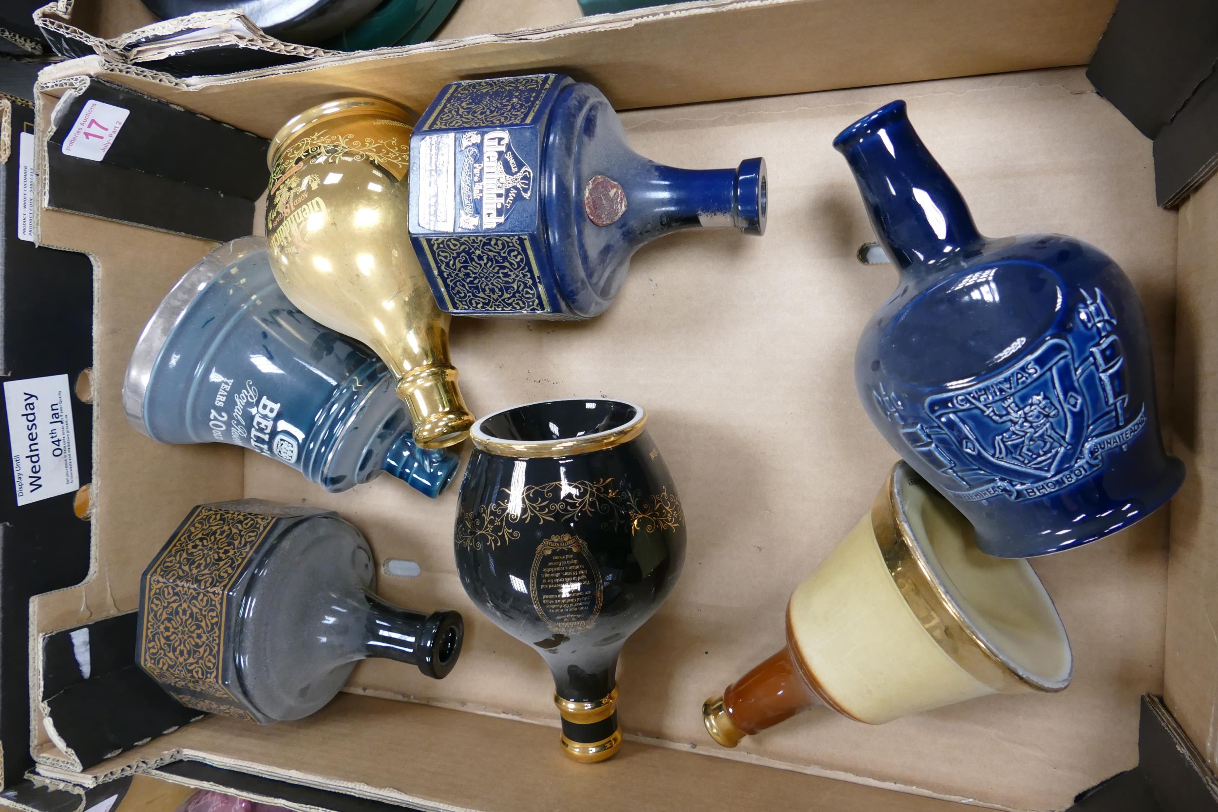 A collection of Wade Whisky & Spirt Decanters to include Bells Glenfiddich , Chivas . These items