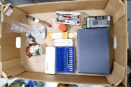 A mixed collection of items to include Lorus & Ceres watches, boxed vintage map measurers, German