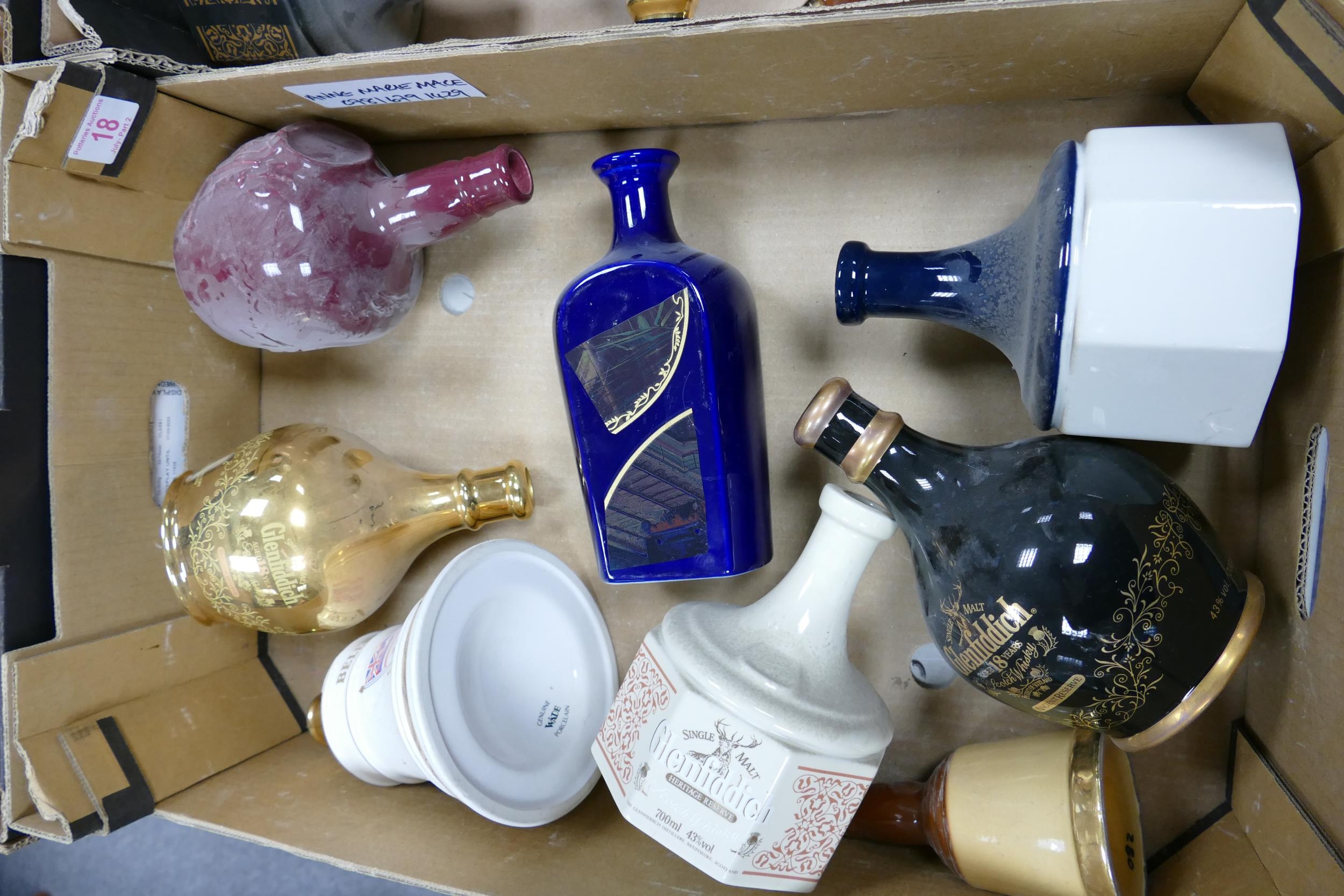 A collection of Wade Whisky & Spirt Decanters to include Bells, Glenfiddich , Chivas . These items