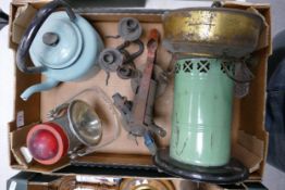 A mixed collection oof items to include paraffin burner, enamelled kettle, brass burners etc