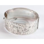 Hallmarked solid silver large bangle, crisply hallmarked and with top half showing nice floral