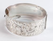 Hallmarked solid silver large bangle, crisply hallmarked and with top half showing nice floral