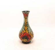 Moorcroft Floral decorated vase . Height 16.5cm , dated 2005. Boxed