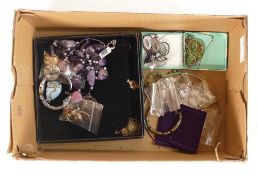 Shoe box containing assorted costume jewellery, includes some hardstone mounted pieces.