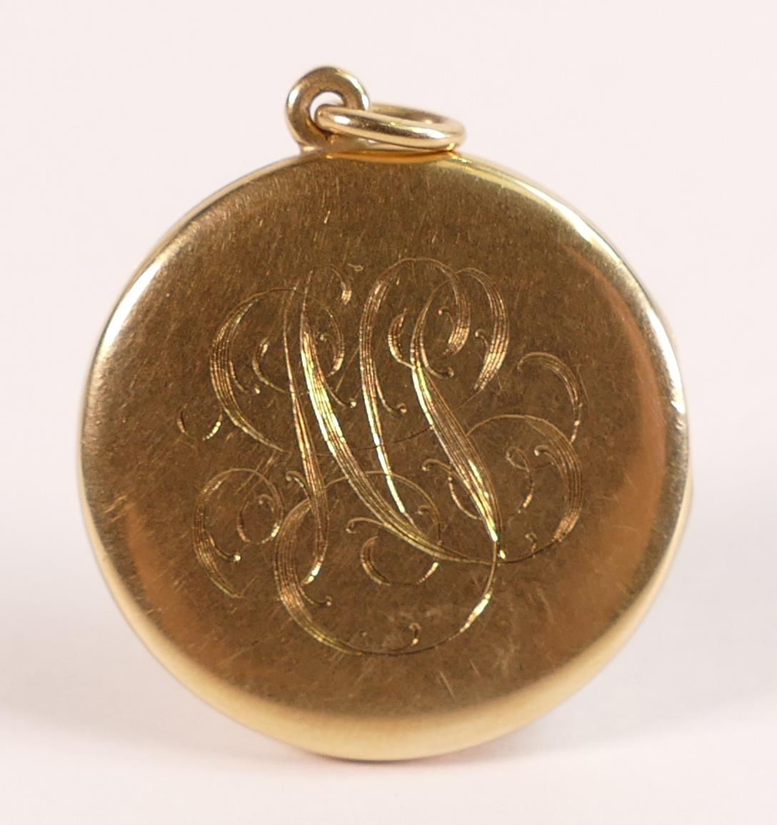 14ct large gold locket, marked 14 and tested as 14ct gold. Engraved with fancy monogram to