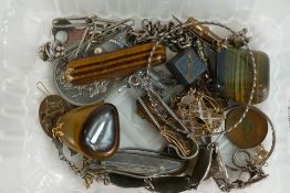 A collection of items including agate pendants, Silver bracelets, 33g, charms, 1951 Five Shillings