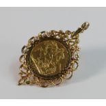 Gold Full Sovereign dated 1882 in 9ct gold ornate mount, 13.5g.