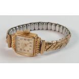 18ct gold ladies Ancre wristwatch with gold plated expandable strap.