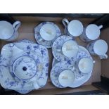 Wedgwood Blue Plum pattern tea ware items to include tea cups and saucers, coffee cups, cake