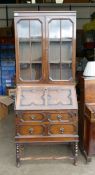 Jacobean Revival Bureau Bookcase. Top with wood banded octagonal windows on barley twist legs and