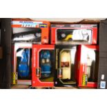 A collection of Boxed Burago scale model Classic Car Vehicles including AC Cobra, Jaguar, Revel