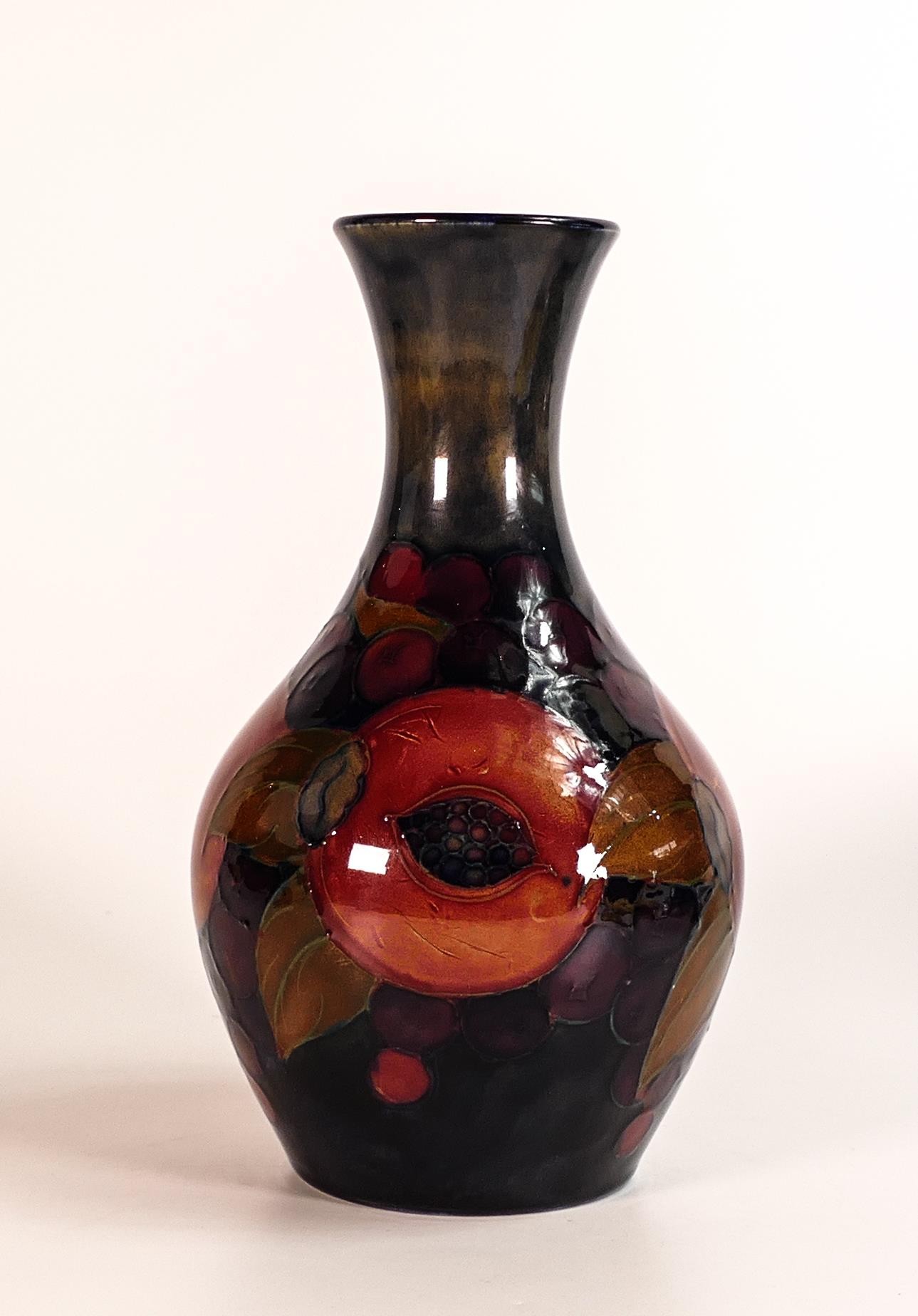 William Moorcroft vase decorated in the Pomegranate design, Some all over crazing. c1920, h.21cm.