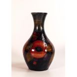 William Moorcroft vase decorated in the Pomegranate design, Some all over crazing. c1920, h.21cm.