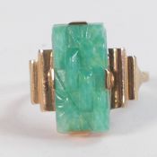 9ct gold and carved jade (or similar) oblong stone (17mm x 9mm), Ring size Q/R, weight 4.49g.