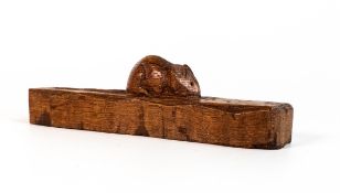 Oak ornament, a single piece of oak with carved 'Mouseman' motif. Measures 14.5cm long.