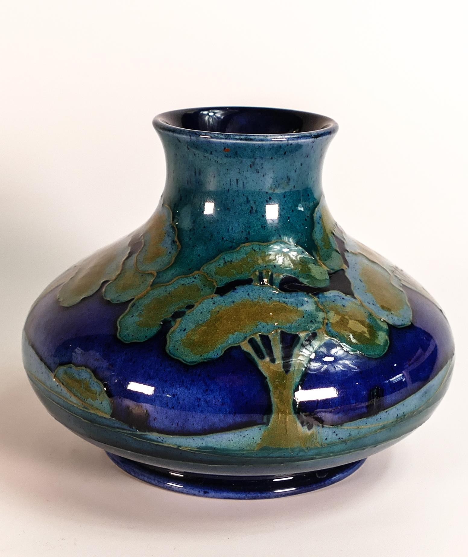 William Moorcroft squat vase decorated in the Moonlit Blue design, c1920s, h.10.5cm.