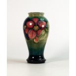 Moorcroft Clematis vase on faded green background. Height 18cm. All over crazing