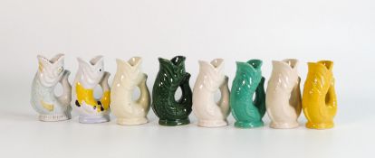 Wade collection of small multicoloured Gluggle jugs (three with hand written script to base).