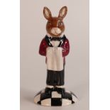 A Royal Doulton prototype Bunnykins figure of a Hotel Waiter holding a serviette and standing on a