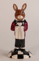 A Royal Doulton prototype Bunnykins figure of a Hotel Waiter holding a serviette and standing on a