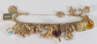 9ct gold charm bracelet with 20 gold charms, gross weight 60.69g