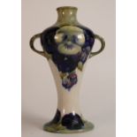 William Moorcroft Burslem two handled vase decorated in the Pansy design on cream & light green