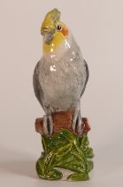 Beswick England prototype figure of a Parrot, standing on a tree branch in colours of grey, yellow