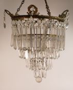 Four tiered light shade, with glass droppers, diameter at largest 30cm.