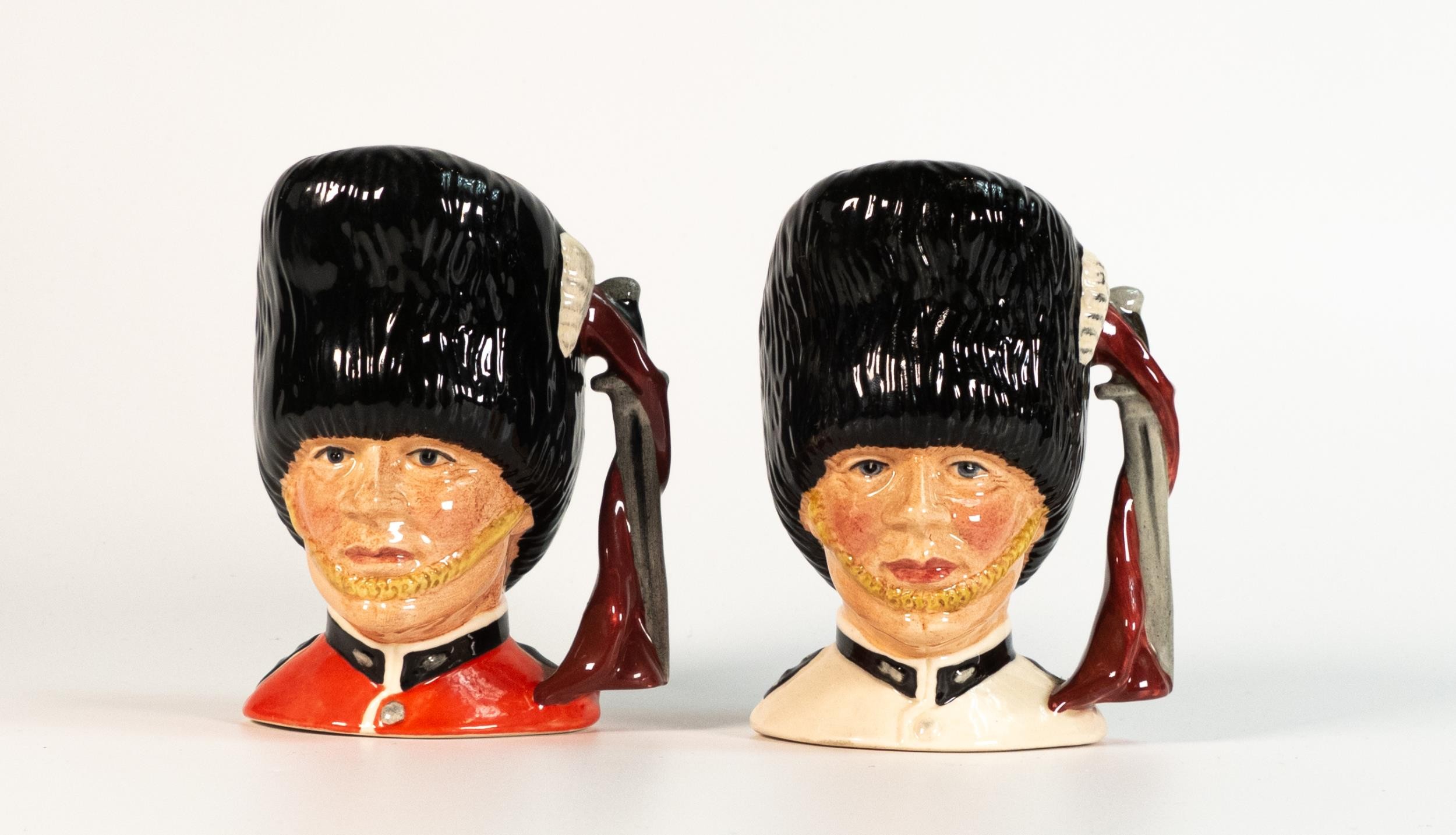 Royal Doulton small character jugs The Guardsman D6771 in two colour ways (2)