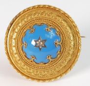 Edwardian circular memorial brooch with blue enamel & diamond set centre with heavy foliate scroll