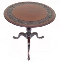 19th century tilt top Mahogany table with later carved decoration to top, diameter of table top 80cm