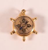 19th century 18ct gold novelty fob in the form of a ships wheel, gross weight 12.5g. Hardstone on