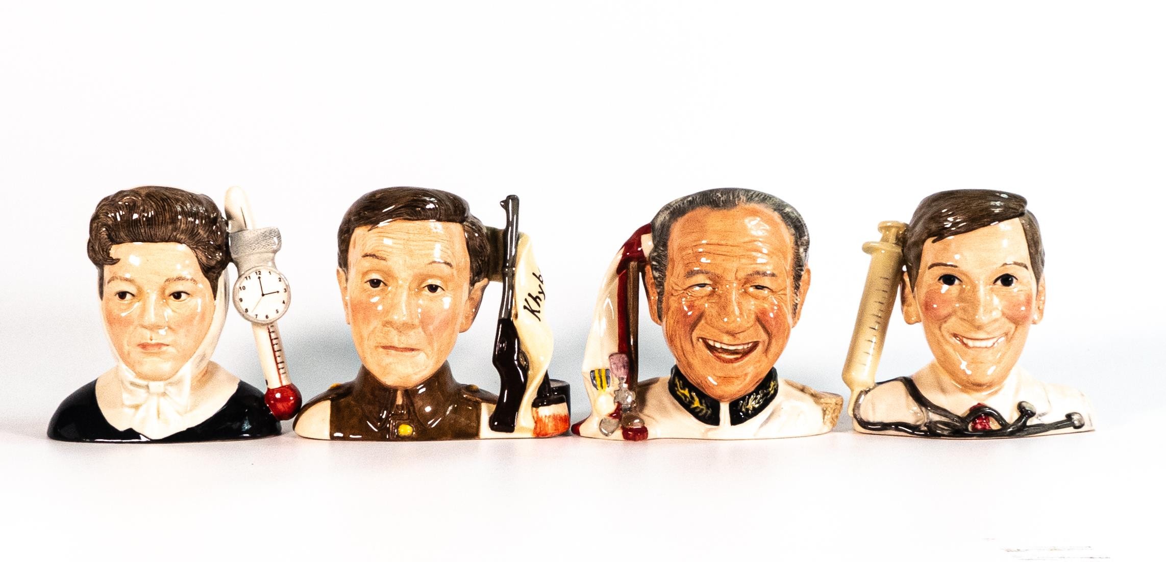 A Royal Doulton set of four character jugs from the Carry On films, Sid James D7162, Charles Hawtrey