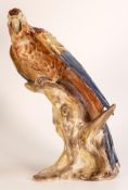 A rare Wade Earthenware model of a parrot perched on a branch designed by Colin Melbourne, C1950s,